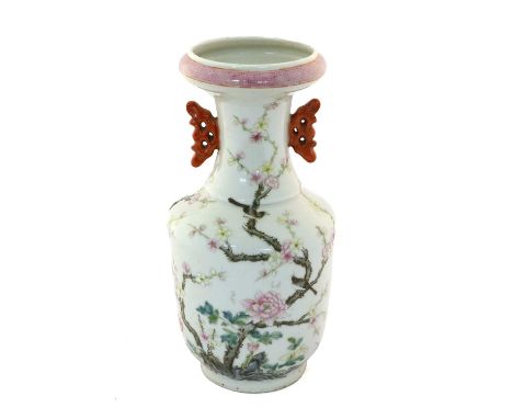 A Chinese Porcelain Twin-Handled Vase, Qianlong mark but not of the period, painted in famille rose enamels with birds and pr