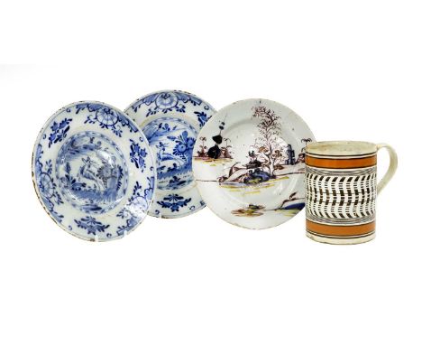 An English Delft Plate, circa 1730, painted in blue, manganese and yellow with a chinoiserie landscape22cm diameterA Similar 
