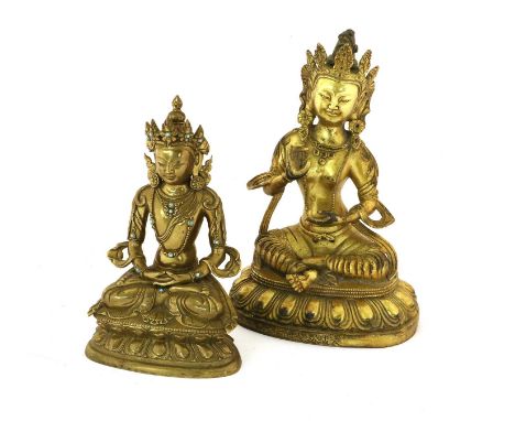 A Sino-Tibetan Gilt Bronze Figure of Buddha,Yongle reign mark but not of the period, seated cross-legged with right hand rais