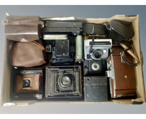 A collection of vintage cameras, two early 20th century bellows cameras, large Polaroid camera, Zeiss Ikon box camera etc 