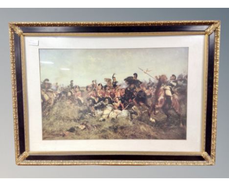 Two decorative gilt-framed prints depicting a 19th century battle scene and a French cafe scene, largest 104 cm x 74 cm. 