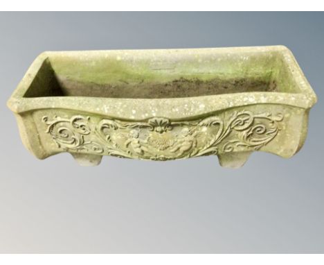 A weathered concrete garden classical planter, width 74 cm 