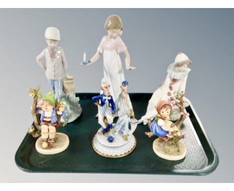 Three Nao figures, two West German bisque porcelain figures of children sitting on tree branches and a further Capodimonte fi