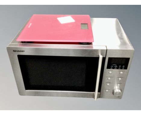 A Sharp digital microwave and John Lewis scale 