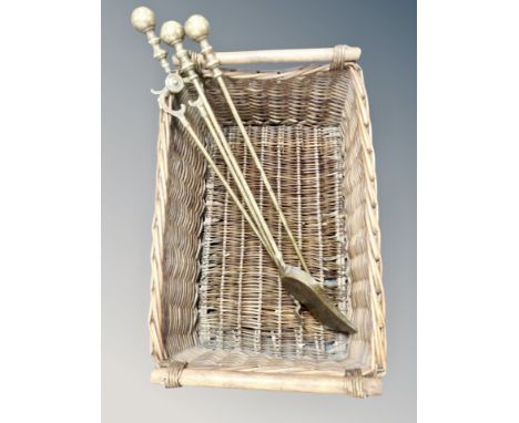 A wicker twin handled hamper and a brass fire companion set 