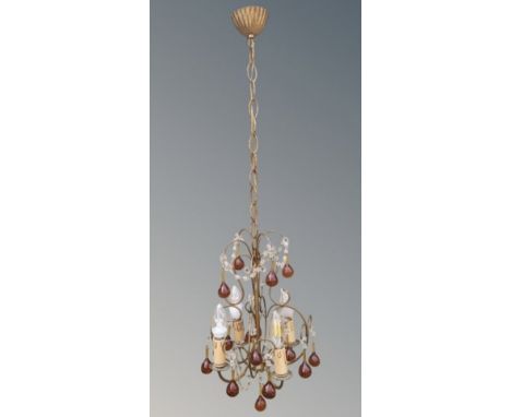 An early 20th century chandelier with amber glass drops 