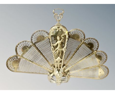 A brass 'Peacock' firescreen 