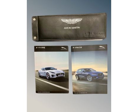 Ten Driver's Manuals/Owner Booklets in Original Wallets : 1 x Aston Martin V8 Vantage, 1 x Jaguar F-Type, 1 x Jaguar F-Pace, 