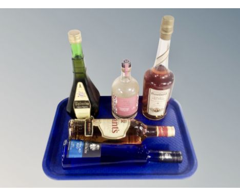 Five bottles of alcohol including Grant's finest Scotch whisky, Tibarine liqueur, Calvados etc  