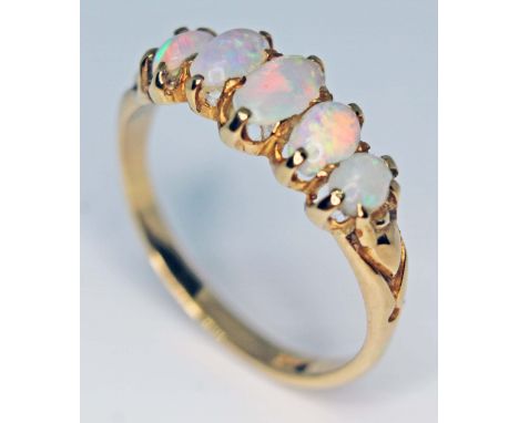 A five stone opal ring, band marked '18ct', gross wt. 3g, size P.  