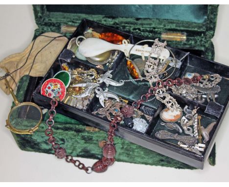 A green velvet jewellery box and contents including silver and other vintage jewellery, enamel, cameo, amber, carved wood bea