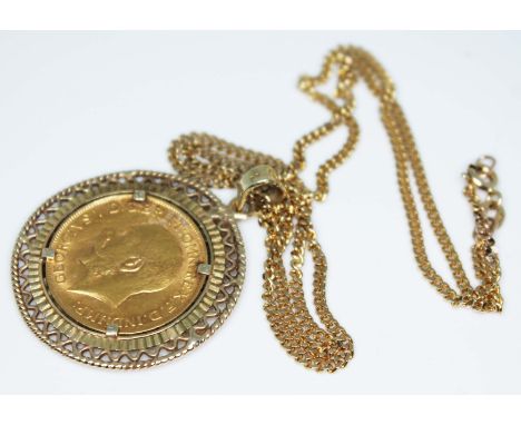 A George V 1918 sovereign in a mount marked '9K' and on hallmarked 9ct gold chain, gross wt. 16.7g.  