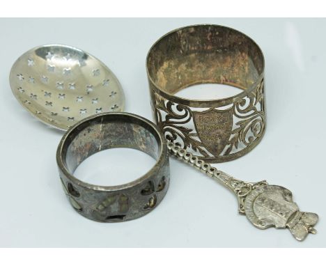A mixed lot of hallmarked silver comprising a Dutch sifting spoon circa 1900, a pierced silver serviette ring and an inlaid s