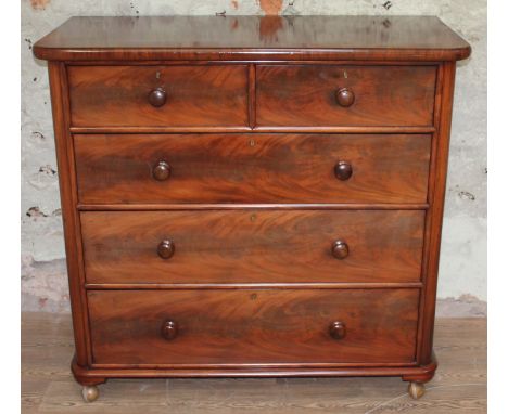 A good quality Victorian mahogany chest of drawers with bun handles, the lock stamped with a 'H' crossed with an arrow, width