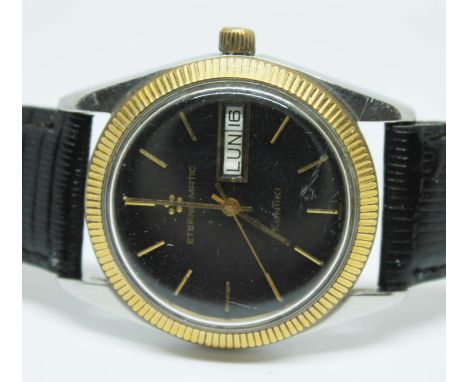 An Eterna-Matic Kontiki 1960s automatic stainless steel wristwatch with black dial, gold tone hands and markers with date and