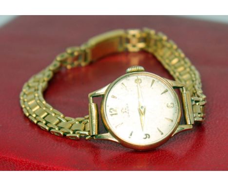 A ladies 9ct gold Omega wristwatch with 9ct gold strap, case diam. 18mm, gross wt. 19.1g.Condition: currently in good working