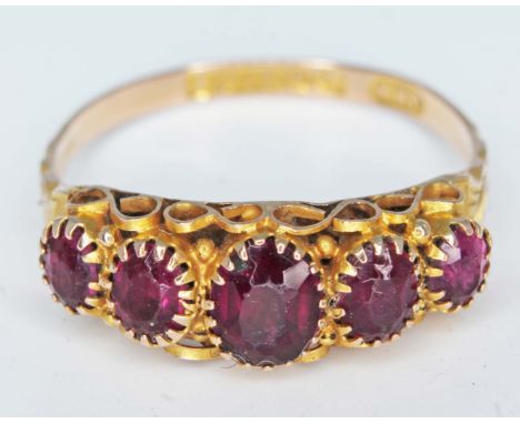 A hallmarked 9ct gold ring set with purple stones, gross wt. 1.4g, size M.  