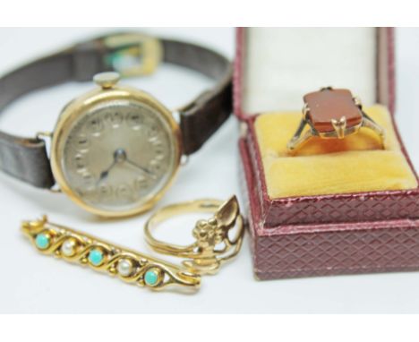 A mixed lot comprising a hallmarked 9ct gold wristwatch, a yellow metal brooch set with pearls and turquoise, a blood stone r