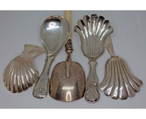 A group of five Georgian and Victorian hallmarked silver caddy spoons, one with ivory handle.  