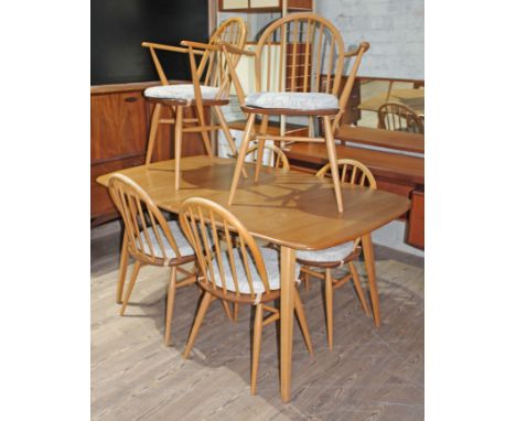 An Ercol light elm and beech extending dining table and six chairs.  Condition - no leaf, appears damage/repair free, general