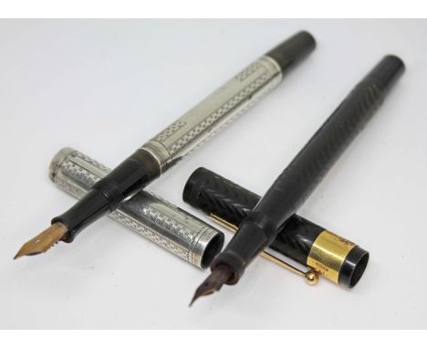 An 18ct gold mounted Swan self filler fountain pen and a Sterling silver Waterman's Ideal, both with 14ct gold nibs.Condition
