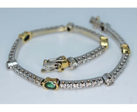 A diamond and emerald bracelet, featuring four oval cut emeralds, total wt. approx. 1 carats, total diamond wt. approx. 2 car