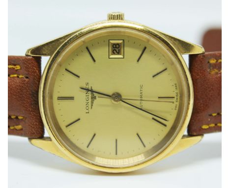 A unisex Longines 1980s automatic datejust gold plated wristwatch, ref 1626-3, the signed gold coloured dial having gold hand