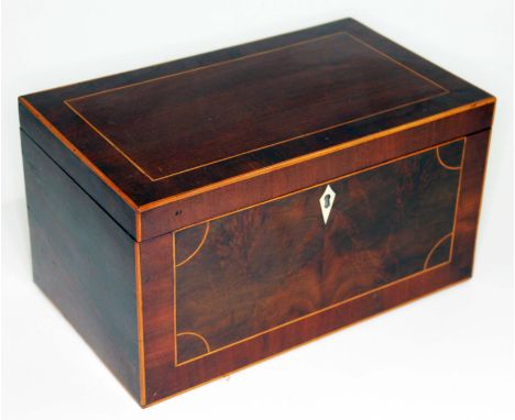 A Georgian mahogany tea caddy, boxwood strung, ivory escutcheon and two interior compartments with turned bone finials, lengt
