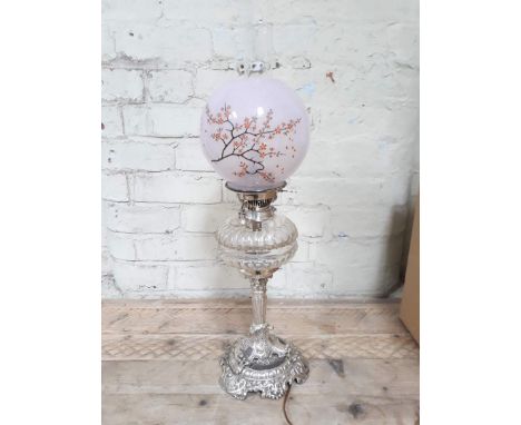 An Evered & Co silver plated oil lamp (converted to electric), with cut glass reservoir and pink glass shade, height includin