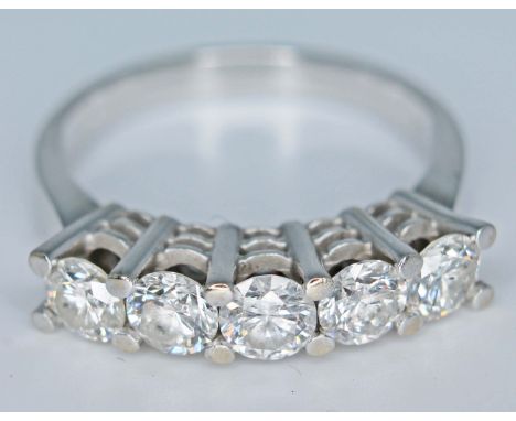 An 18ct white gold five stone diamond ring, each round brilliant cut stone approx. 0.25 carats, gross diamond wt. approx. 1.2