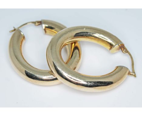 A pair of hallmarked 9ct gold earrings, wt. 4.7g.  