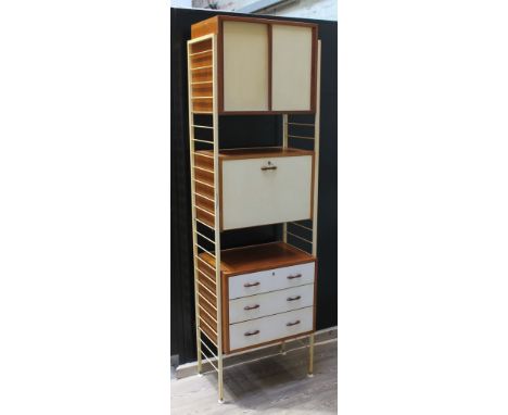 A Staples Ladderax unit comprising two white ladders, white and teak sliding door cabinet, white and teak drop front cabinet 