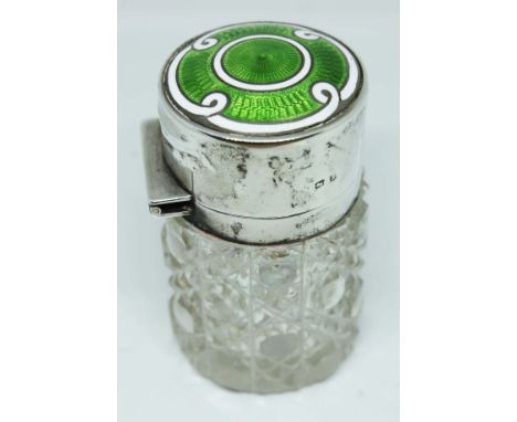 A silver and enamel cut glass scent bottle, Henry Matthews, Birmingham 1910, height 7cm.  