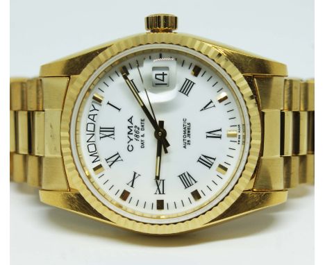 A CYMA unisex automatic day & date stainless steel gold tone wristwatch on stainless steel strap with display back revealing 
