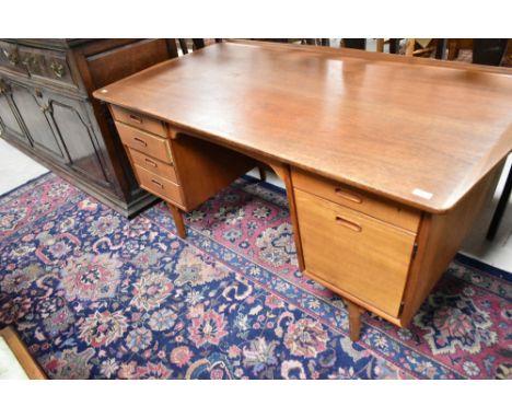 A vintage Scandinavian teak desk, Svend and Madsen design , marked to drawers Made in Denmark with SH mark, slight damage to 