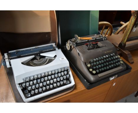 A vintage Imperial typewriter, in grey finish, with zipped case and a Smith Corona typewriter in hard case