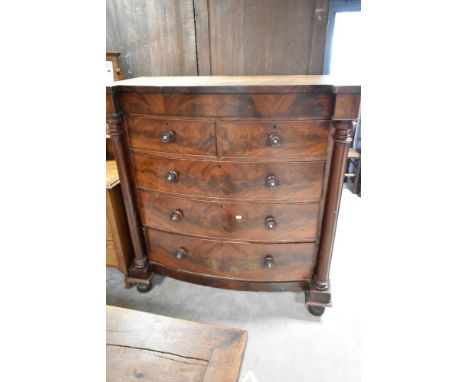 A 19th Century mahogany scotch style chest having bow fronted flame mahogany drawer section (secret frieze plus two over thre