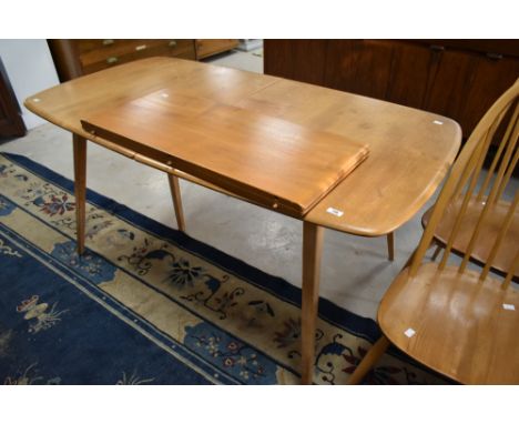 A light Ercol Windsor style extending dining table, approx. 152 x 82cm, plus butterfly leaf adding extra 72cm
