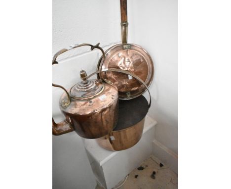 A traditional copper kettle, jam pan and warming pan