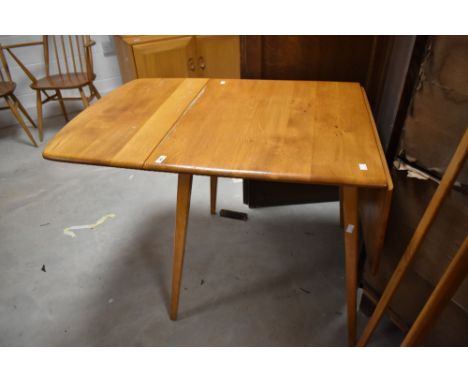 A vintage Ercol Windsor style drop leaf table, approx width 74cm (open length 137cm)