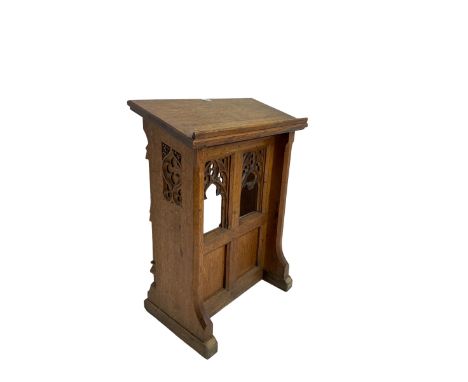 19th century oak ecclesiastical reading stand, panelled support with pierced arch design and chamfered uprights, on sledge fe