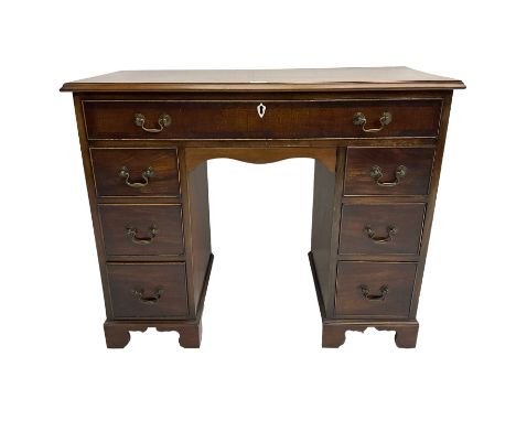 Georgian design twin pedestal kneehole desk, rectangular top with moulded edges over single frieze drawer and knee drawer, pe