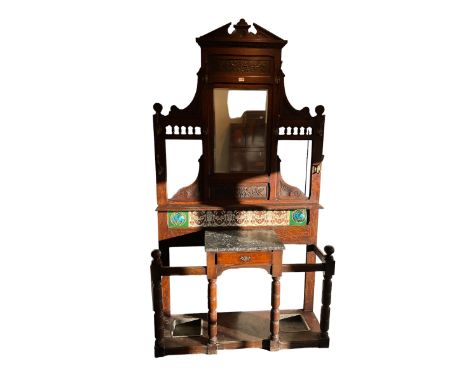 Edwardian oak hallstand, shaped pediment with egg and dart cornice and carved panelled frieze, bevelled mirror above shelf, t