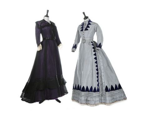 A group of mostly Victorian clothing, late 1850s-1910s, including an early 1870s but altered blue taffeta gown trimmed with t