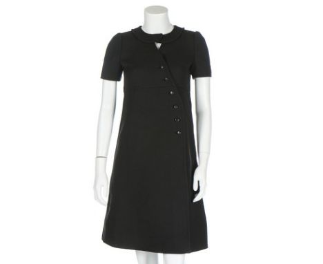 A Courrèges black wool dress, circa 1970, Couture Future labelled and numbered 044970, with peter-pan collar and asymmetric b