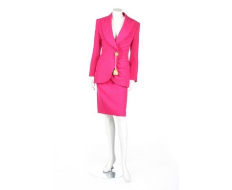 A Christian Dior Boutique hot-pink wool suit, 1980s, labelled, the jacket with large gold beaded and cord tassel, bust 92cm, 