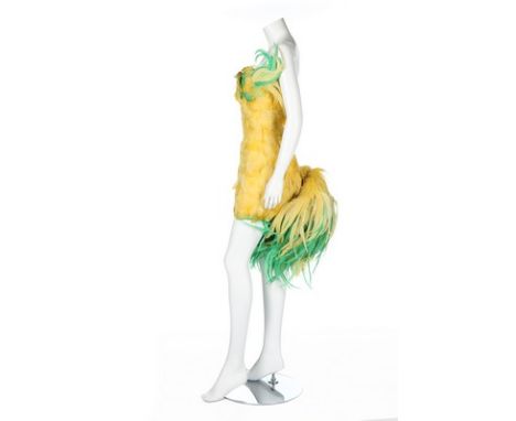 Jerry Hall's Antony Price 'chicken' dress, 1990s, labelled, the short dress of yellow and green plumes with adjustable tail s