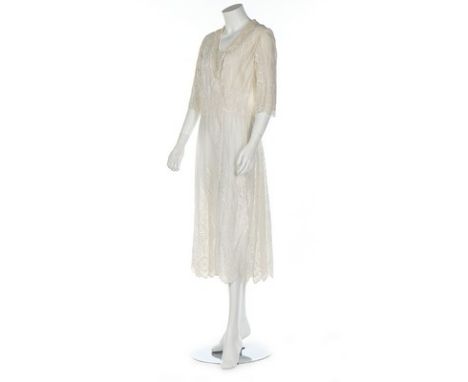 A whitework muslin dress, early 1920s, with scalloped hem and Valenciennes lace edged yoke and sleeves, bust approx 92cm, 36i