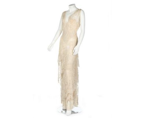 An 1860s Brussels Point de Gaze ivory evening/bridal gown, 1930s, un-labelled, lined in nude chiffon, with flounced tiered sk