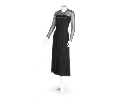 A Chanel haute couture black chiffon dress, 1978, un-labelled, with knife-pleated skirt and bodice, the original strapless sl